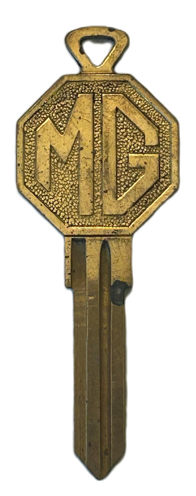 MG LOGO BRASS KEY BLANK UNCUT